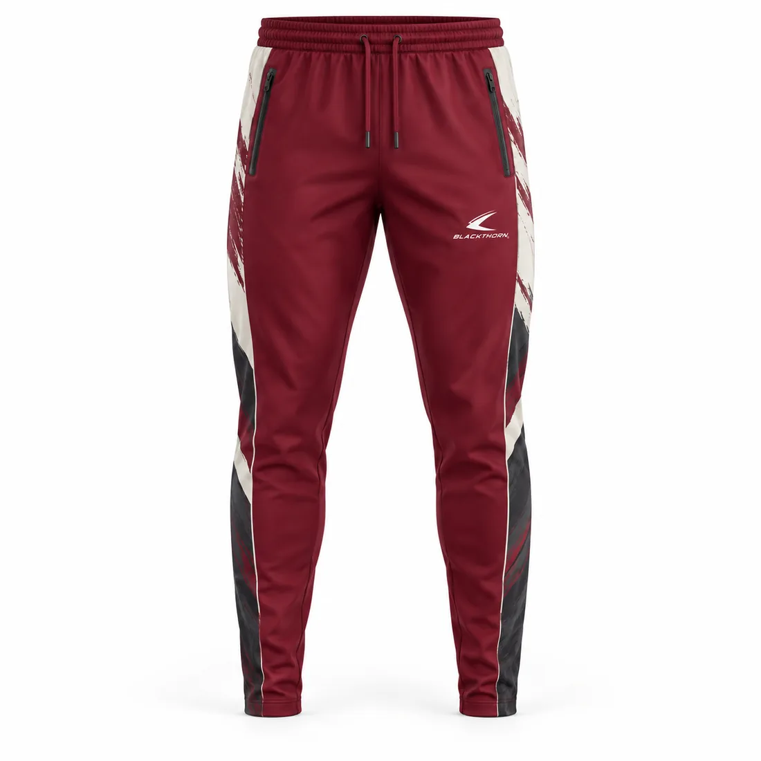 Burgundy tapered coach pants with cream brushstroke sublimation and zip side pockets, front view