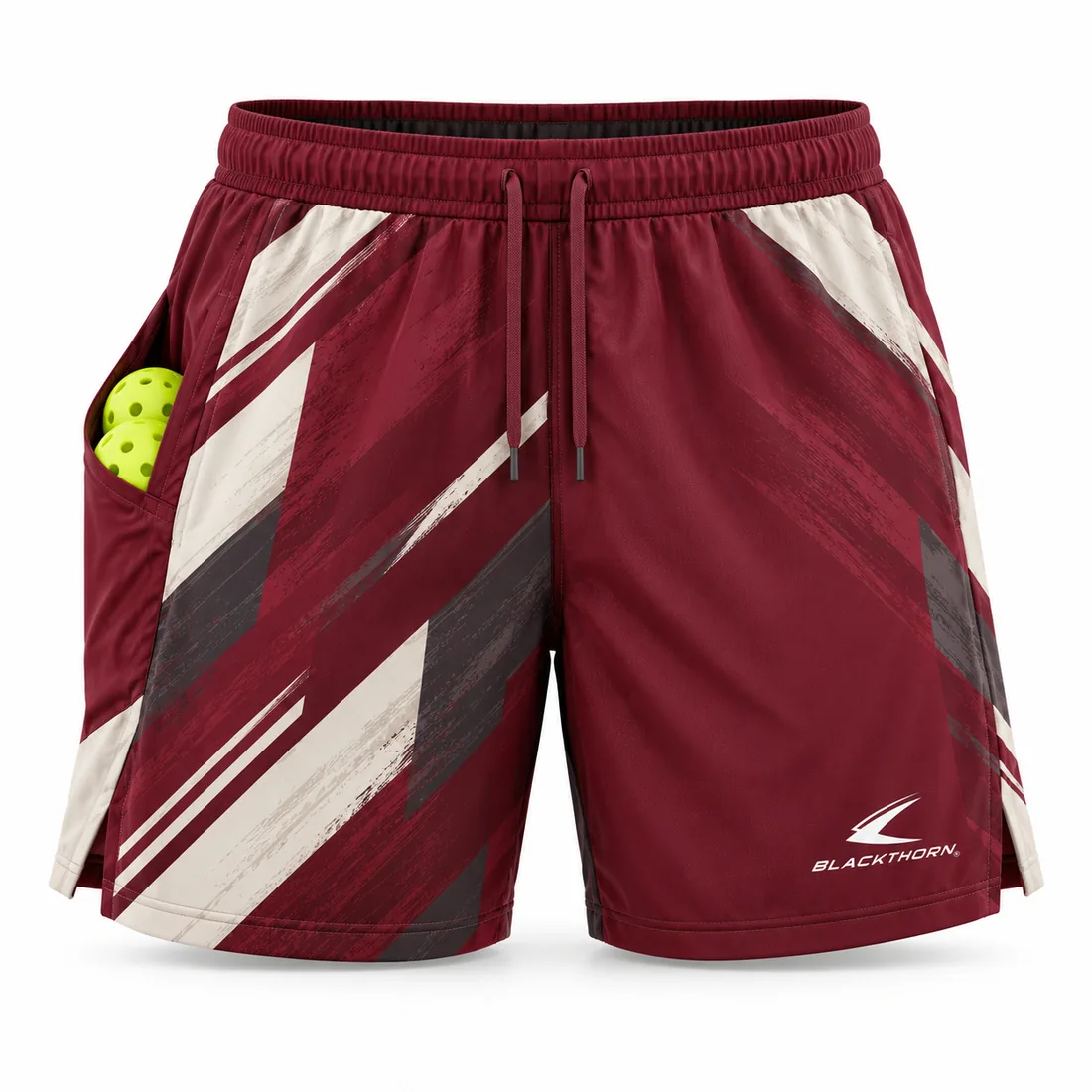 Burgundy and cream pickleball shorts with dry-brush stroke graphics and deep ball pocket, front view
