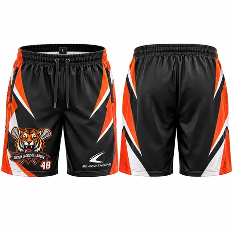 Custom sublimated lacrosse shorts, black and orange — front and back