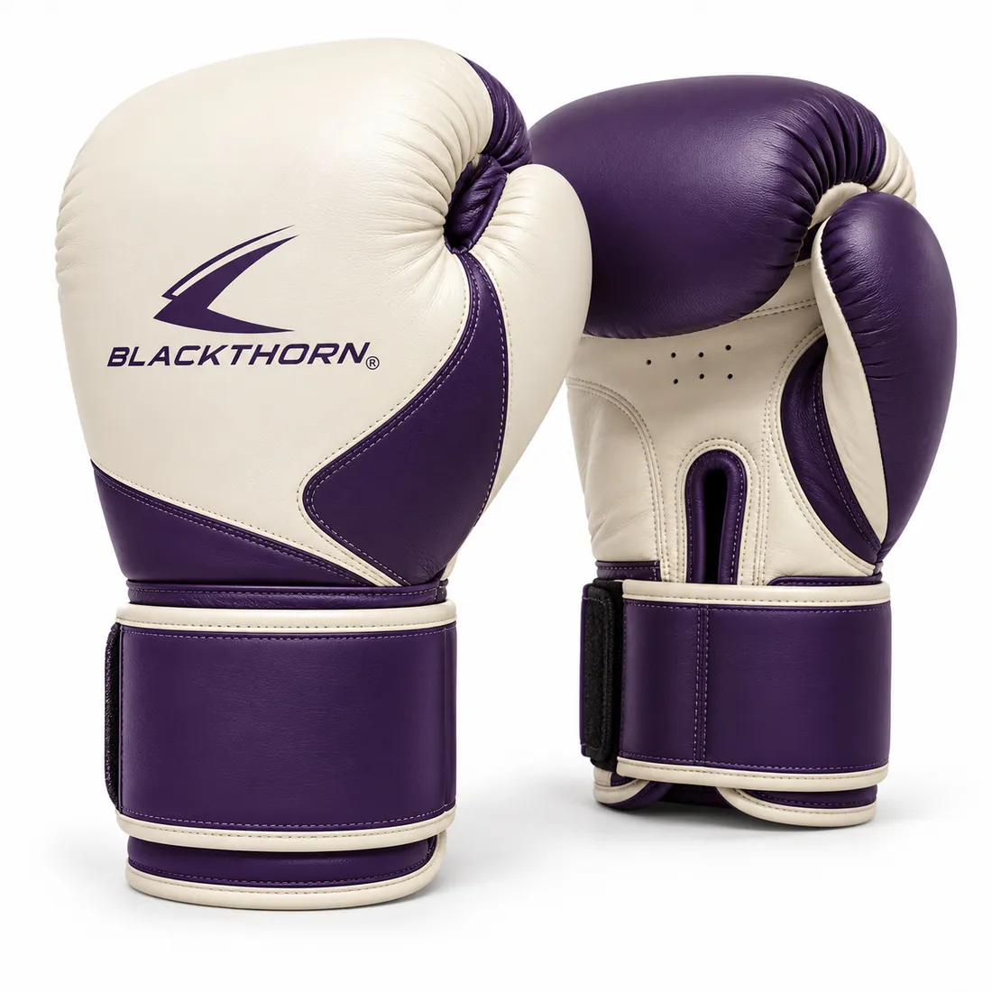 Pair of ivory sparring gloves with violet thumb side and violet wide wrist strap