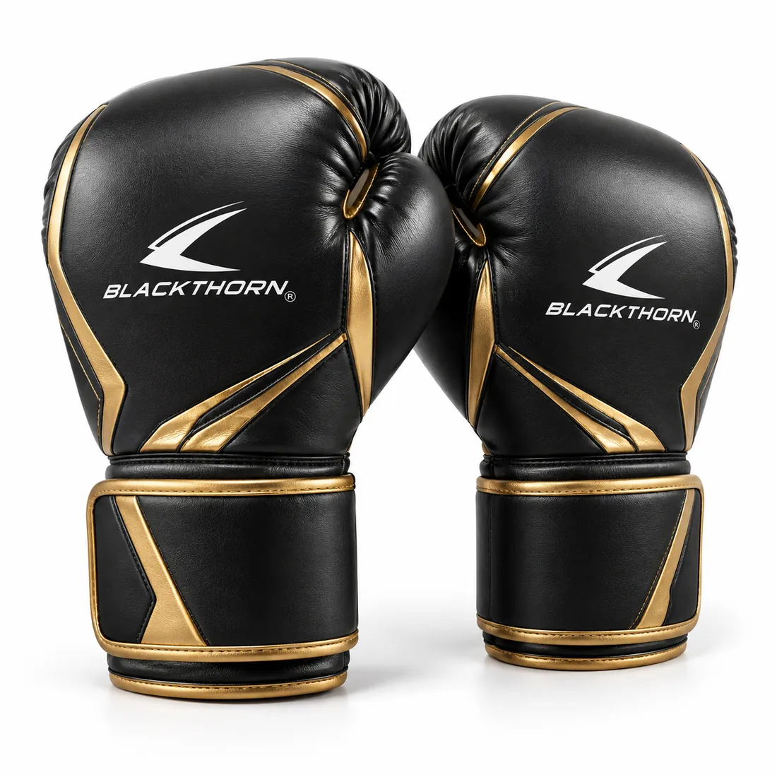Pair of black sparring gloves with curved gold lines and gold-trimmed wide wrist strap